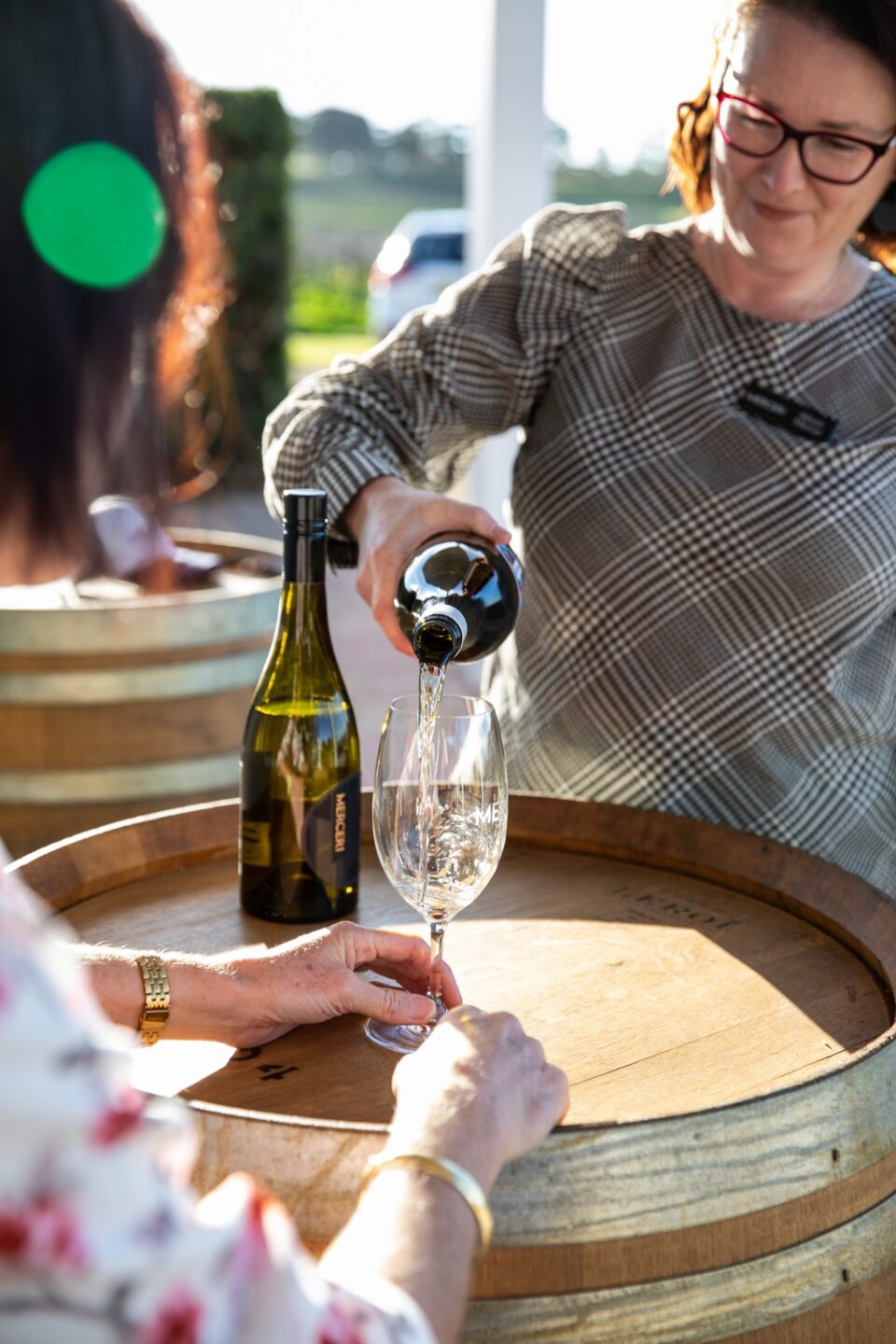 Wine being poured at a cellar door tasting table