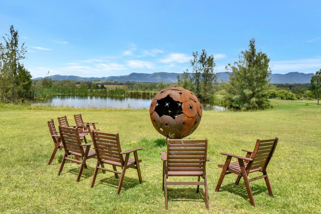 Silver Springs Estate dam, fire pit and Brokenback Range, Rothbury, Hunter Valley