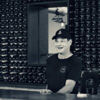 Adam Kossak at the cellar door counter
