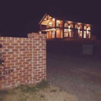 The cellar door lit up at night